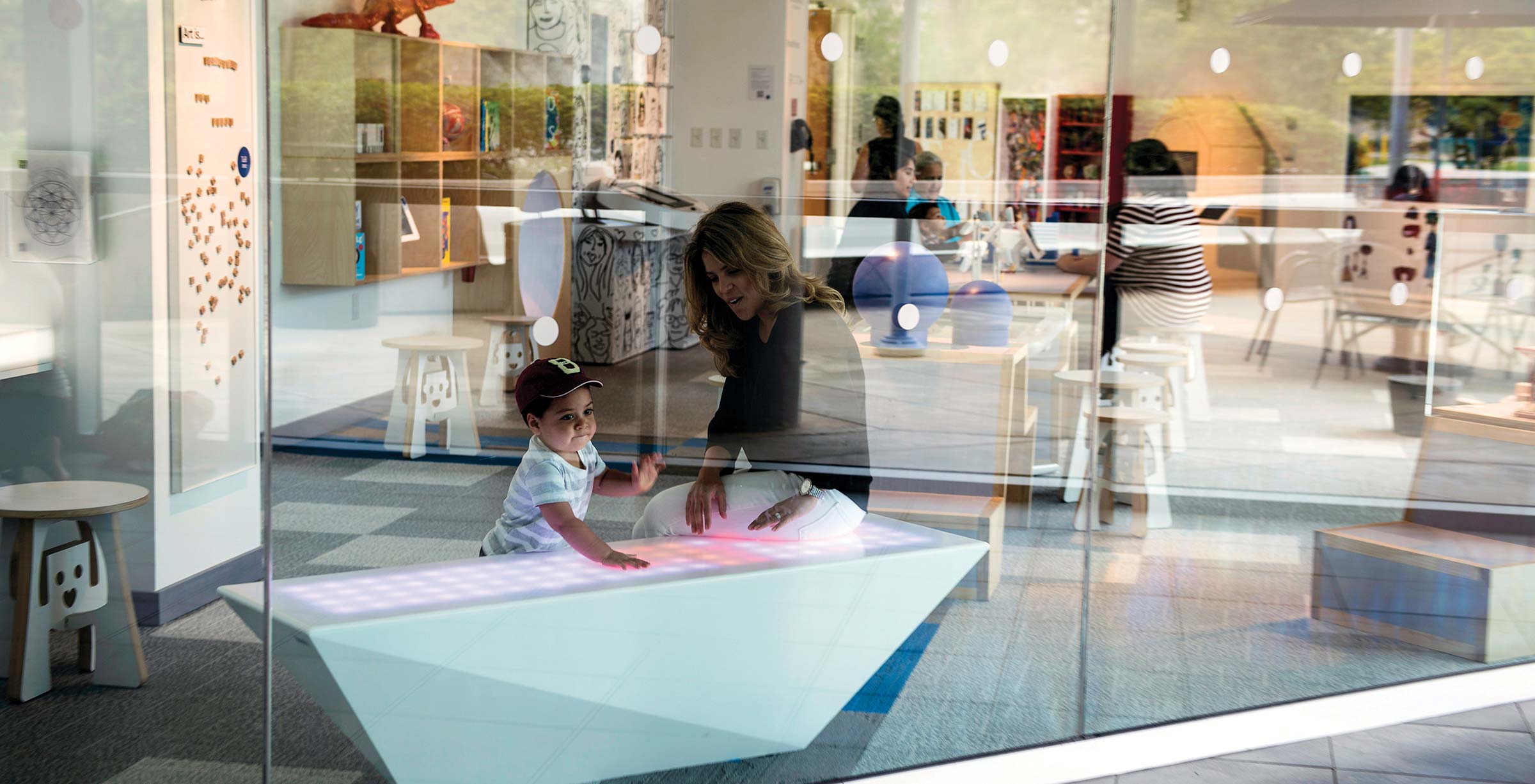 Mom playing with child at the Young At Art Museum Mom playing with child at the Young At Art Museum