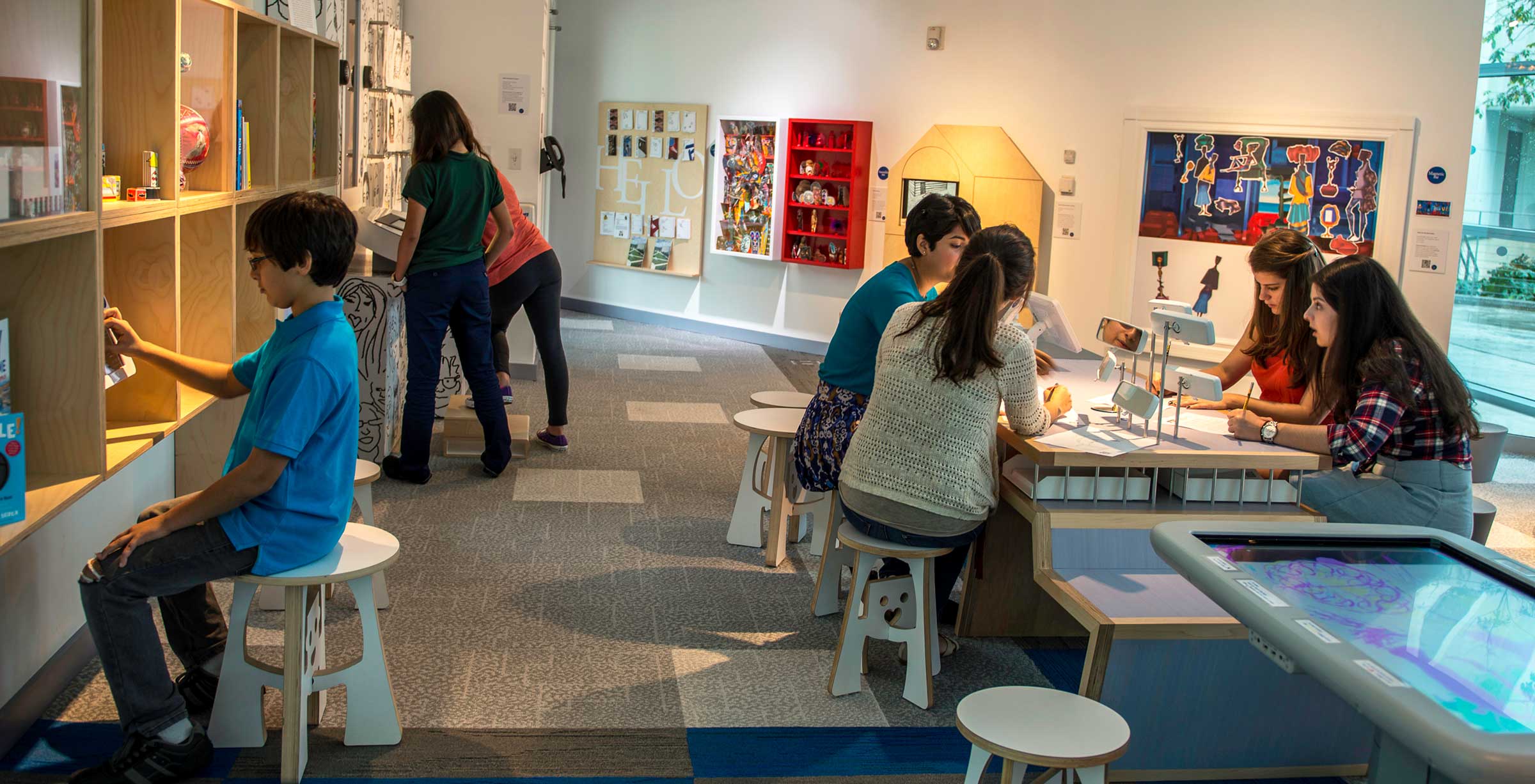 children interacting with the exhibits at the Frost Art Museum